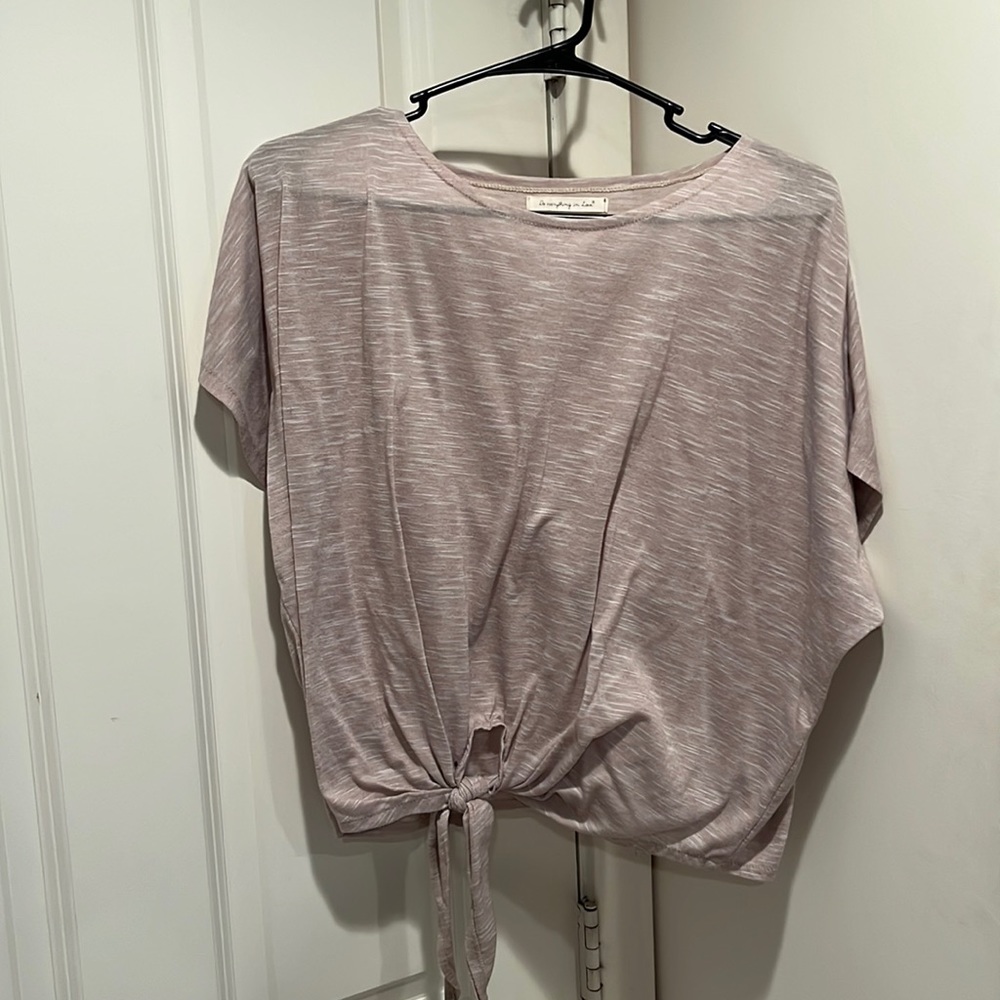 Crop top/short sleeve top with tie on the bottom. Gently worn. Size M